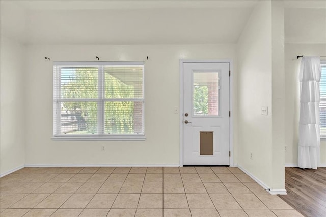 11321 NW 103rd St, Yukon, OK 73099 - foyer featuring plenty of natural light and light tile patterned flooring