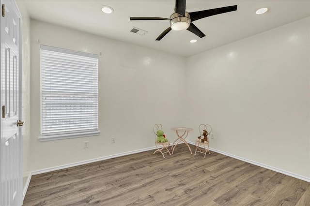 11321 NW 103rd St, Yukon, OK 73099 - spare room featuring wood finished floors, ceiling fan, and recessed lighting