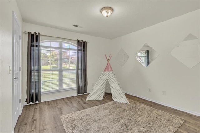 11321 NW 103rd St, Yukon, OK 73099 - recreation room featuring wood finished floors and baseboards