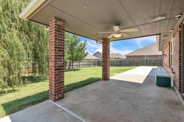 11321 NW 103rd St, Yukon, OK 73099 - fenced backyard featuring ceiling fan and a patio area