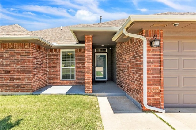 11321 NW 103rd St, Yukon, OK 73099 - doorway to property with brick siding, roof with shingles, a garage, and a lawn