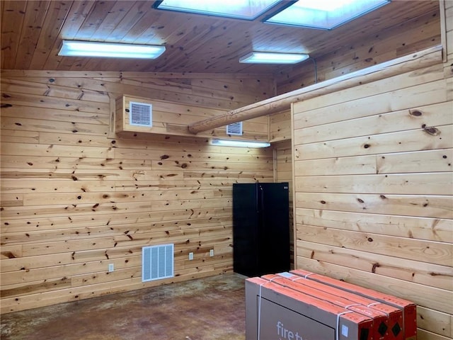50 Spearfish Rd, Broken Bow, OK 74728 - misc room with wooden walls, wood ceiling, concrete flooring, a skylight, and lofted ceiling