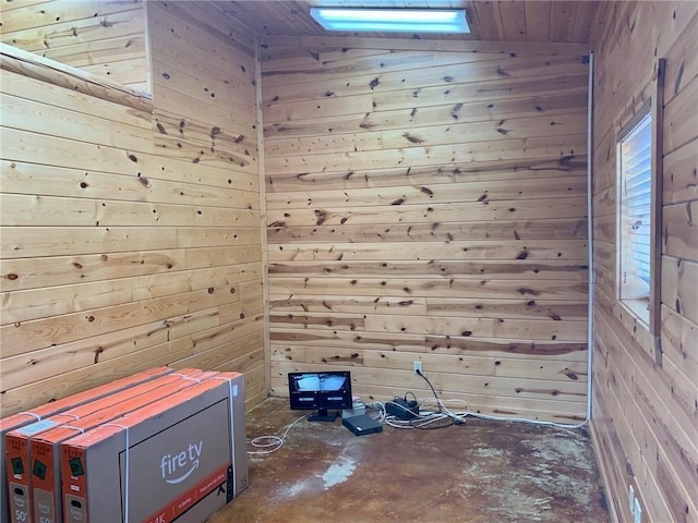 50 Spearfish Rd, Broken Bow, OK 74728 - unfurnished room featuring wooden walls and unfinished concrete floors