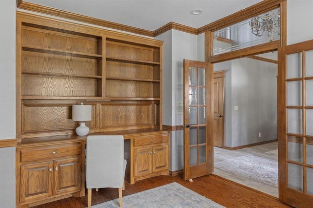 4719 W Two Lakes Ave, Norman, OK 73072 - unfurnished office featuring french doors, built in study area, ornamental molding, and dark wood-style flooring