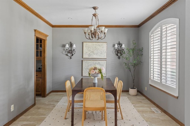 4719 W Two Lakes Ave, Norman, OK 73072 - dining area featuring plenty of natural light, a chandelier, crown molding, and light wood-style floors