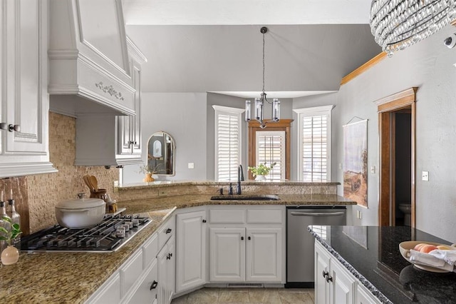 4719 W Two Lakes Ave, Norman, OK 73072 - kitchen with appliances with stainless steel finishes, white cabinets, and tasteful backsplash