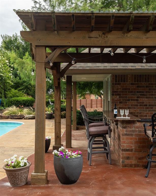4719 W Two Lakes Ave, Norman, OK 73072 - view of patio / terrace with an outdoor pool