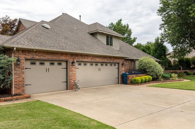 4719 W Two Lakes Ave, Norman, OK 73072 - view of property exterior with roof with shingles, brick siding, concrete driveway, and a garage