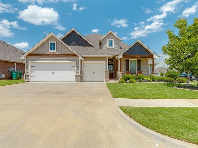 10101 NW 137th St, Yukon, OK 73099 - craftsman inspired home featuring a front yard, concrete driveway, a garage, and board and batten siding