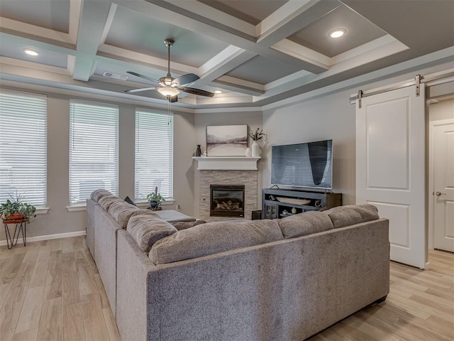 10101 NW 137th St, Yukon, OK 73099 - living area with light wood-style floors, a ceiling fan, healthy amount of natural light, coffered ceiling, and beamed ceiling