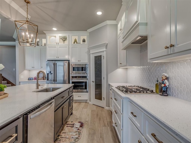 10101 NW 137th St, Yukon, OK 73099 - kitchen featuring stainless steel appliances, premium range hood, recessed lighting, pendant lighting, and white cabinets
