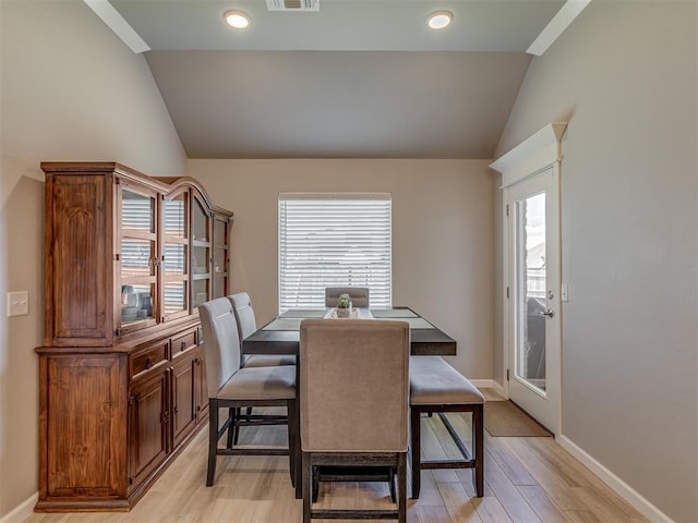 10101 NW 137th St, Yukon, OK 73099 - dining room featuring vaulted ceiling and light wood-style flooring