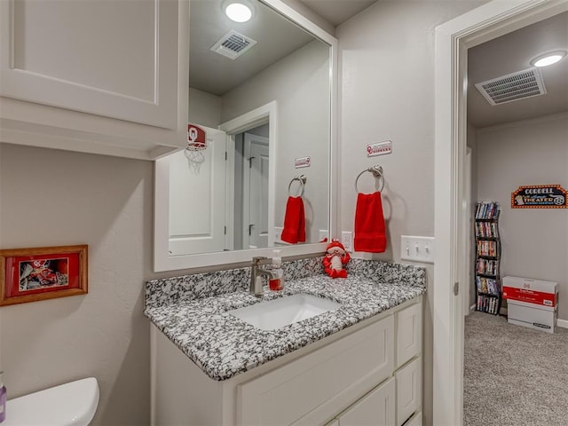 10101 NW 137th St, Yukon, OK 73099 - bathroom featuring vanity and toilet