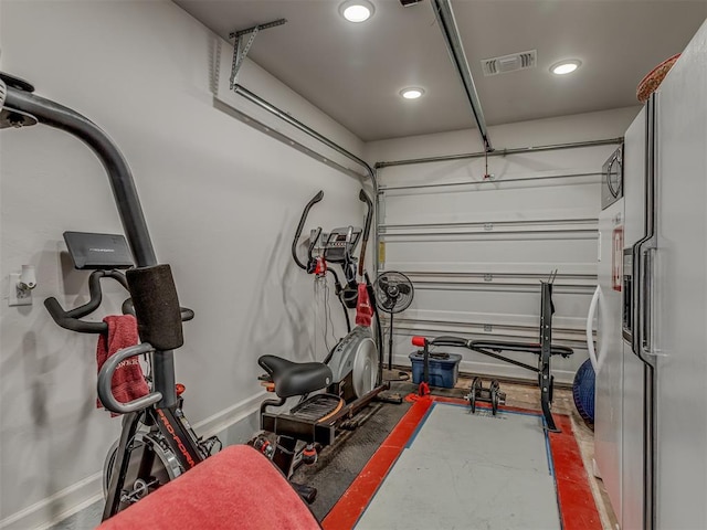 10101 NW 137th St, Yukon, OK 73099 - garage with white refrigerator with ice dispenser and recessed lighting