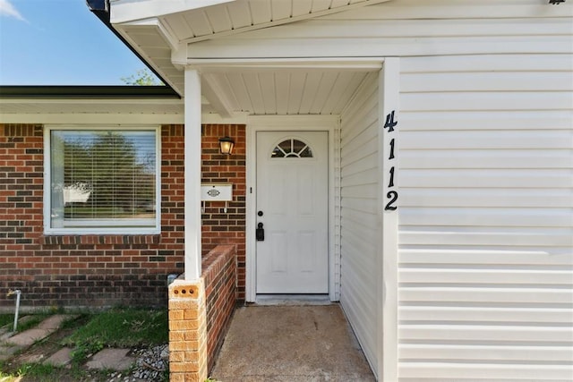 4112 SE 22nd St, Del City, OK 73115 - doorway to property featuring brick siding