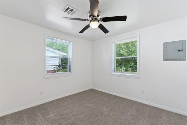 4112 SE 22nd St, Del City, OK 73115 - carpeted empty room featuring electric panel, plenty of natural light, and a ceiling fan