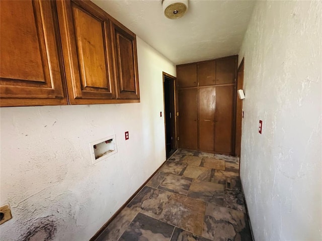 302 NE 60th St, Oklahoma City, OK 73105 - laundry room with cabinet space, hookup for a washing machine, and stone finish flooring