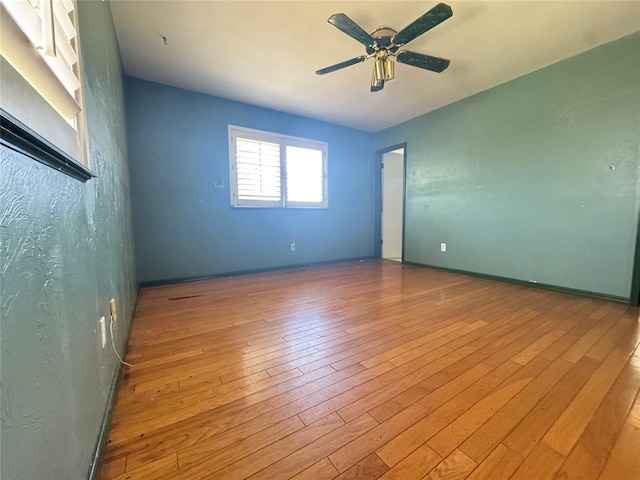 302 NE 60th St, Oklahoma City, OK 73105 - empty room with wood finished floors and ceiling fan