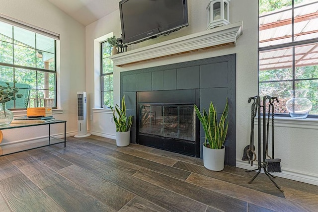 22797 N Henney Rd, Luther, OK 73054 - detailed view of a fireplace, wood finished floors, and a textured wall