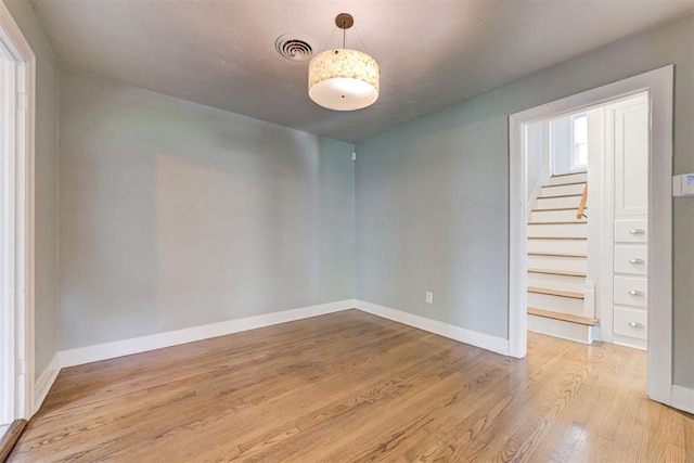 701 NW 46th St, Oklahoma City, OK 73118 - empty room with wood finished floors and stairway