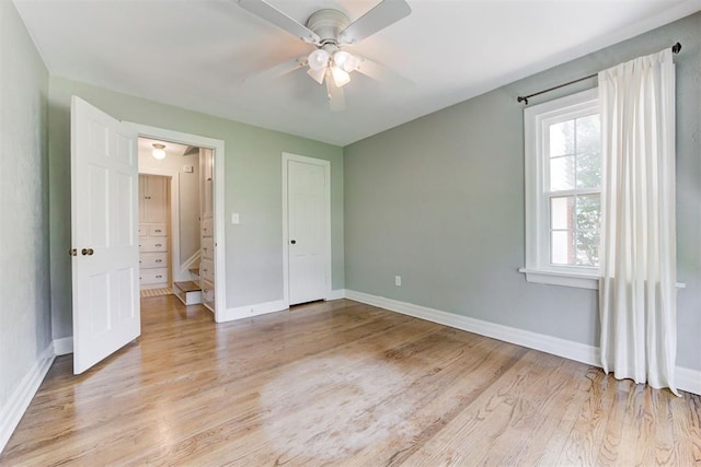 701 NW 46th St, Oklahoma City, OK 73118 - unfurnished bedroom with light wood-style floors and a ceiling fan