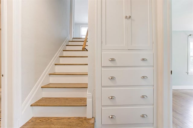 701 NW 46th St, Oklahoma City, OK 73118 - staircase with plenty of natural light and wood finished floors