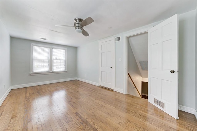 701 NW 46th St, Oklahoma City, OK 73118 - unfurnished bedroom featuring light wood-style flooring and ceiling fan