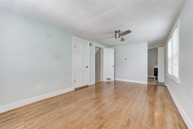 701 NW 46th St, Oklahoma City, OK 73118 - unfurnished living room featuring ceiling fan and light wood-style floors