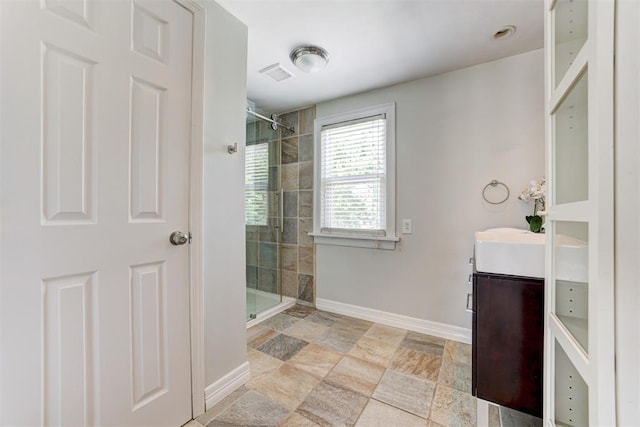 701 NW 46th St, Oklahoma City, OK 73118 - bathroom with a stall shower, vanity, and stone finish flooring