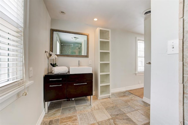 701 NW 46th St, Oklahoma City, OK 73118 - bathroom with vanity, stone finish flooring, recessed lighting, and a shower