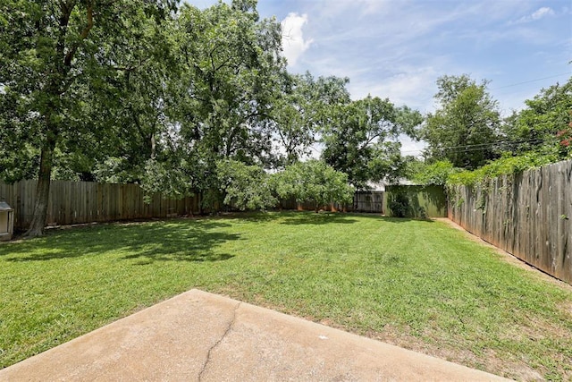 701 NW 46th St, Oklahoma City, OK 73118 - fenced backyard featuring a patio