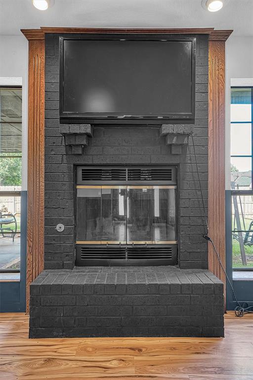 3208 Quail Cir, Altus, OK 73521 - detailed view of a fireplace and wood finished floors