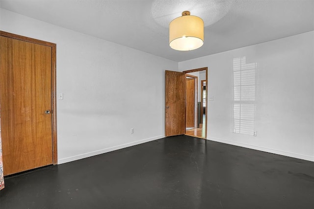 3208 Quail Cir, Altus, OK 73521 - spare room with concrete flooring