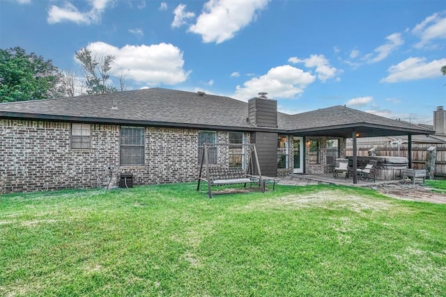 3208 Quail Cir, Altus, OK 73521 - rear view of property featuring a patio area, a chimney, brick siding, roof with shingles, and a hot tub