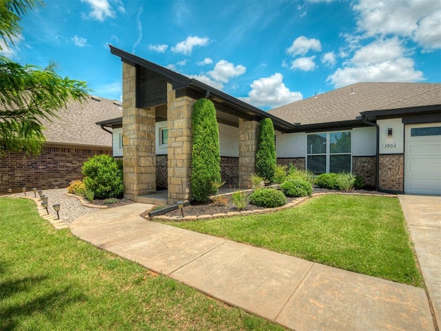 3903 Painted Bird Ln, Norman, OK 73071 - mid-century inspired home with a front lawn, brick siding, roof with shingles, and stone siding