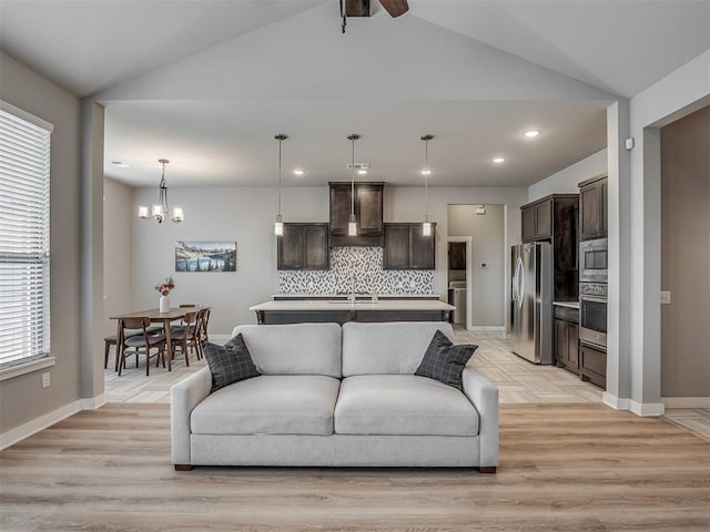 3903 Painted Bird Ln, Norman, OK 73071 - living area featuring vaulted ceiling, a chandelier, recessed lighting, light wood-style floors, and ceiling fan
