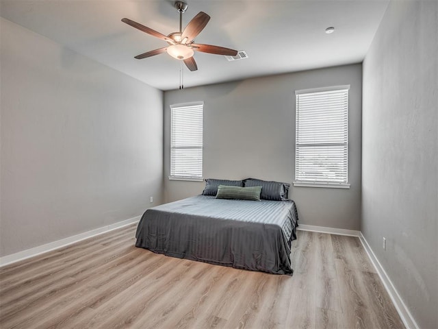 3903 Painted Bird Ln, Norman, OK 73071 - bedroom with wood finished floors and ceiling fan