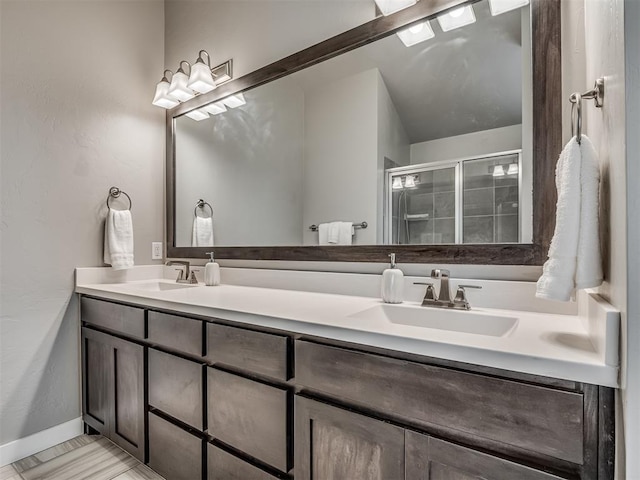 3903 Painted Bird Ln, Norman, OK 73071 - bathroom featuring double vanity and a shower stall