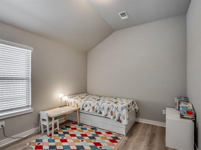 3903 Painted Bird Ln, Norman, OK 73071 - bedroom with wood finished floors and vaulted ceiling