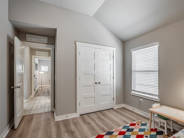 3903 Painted Bird Ln, Norman, OK 73071 - bedroom with vaulted ceiling and light wood finished floors