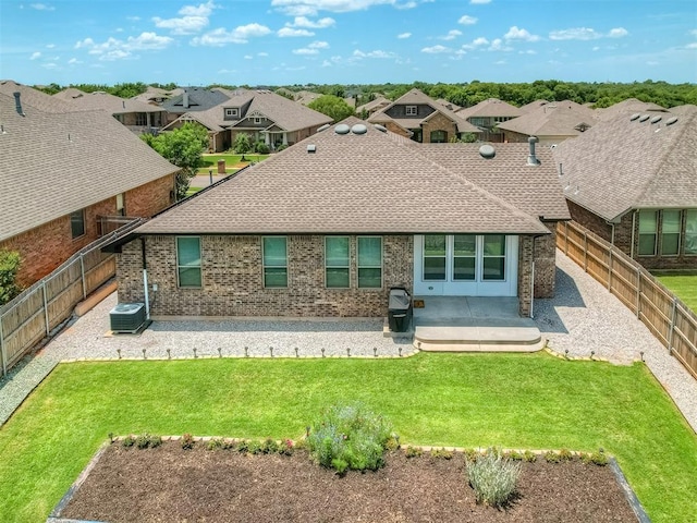 3903 Painted Bird Ln, Norman, OK 73071 - rear view of property with a patio, a fenced backyard, roof with shingles, brick siding, and a residential view