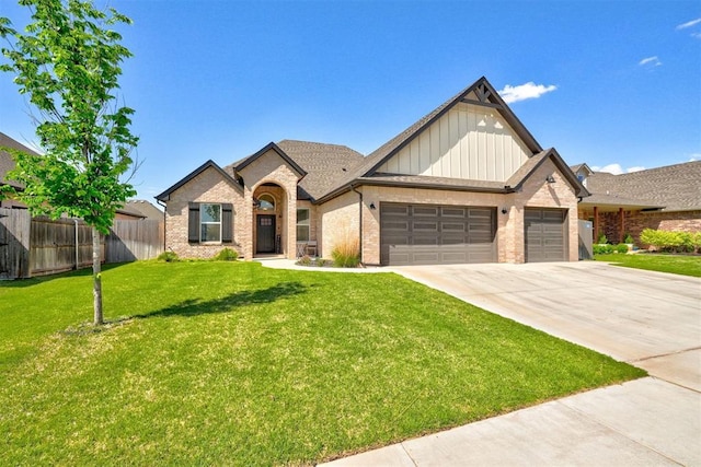 13513 NW 1st St, Yukon, OK 73099 - view of front of property featuring an attached garage, concrete driveway, board and batten siding, and brick siding