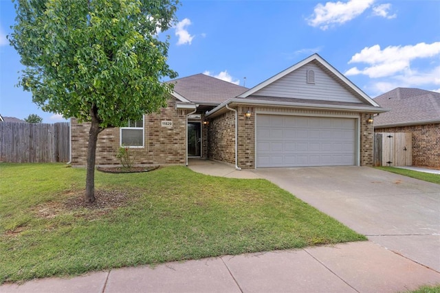 11829 NW 133rd St, Piedmont, OK 73078 - view of front of property featuring driveway, an attached garage, and brick siding