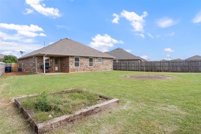 11829 NW 133rd St, Piedmont, OK 73078 - fenced backyard featuring a patio area and a vegetable garden