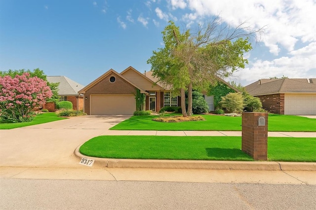 8317 NW 105th St, Oklahoma City, OK 73162 - view of front of property with brick siding, a garage, concrete driveway, and a front yard