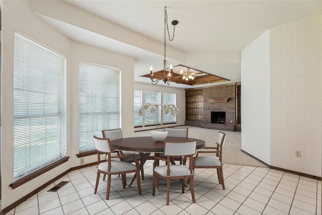 8317 NW 105th St, Oklahoma City, OK 73162 - dining room featuring a chandelier and a brick fireplace