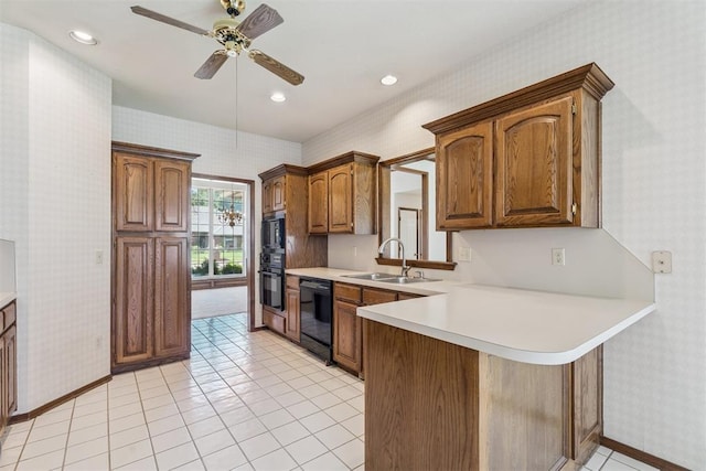 8317 NW 105th St, Oklahoma City, OK 73162 - kitchen featuring wallpapered walls, black appliances, a ceiling fan, light countertops, and a peninsula