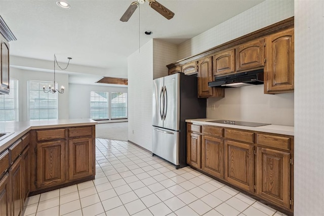8317 NW 105th St, Oklahoma City, OK 73162 - kitchen with freestanding refrigerator, under cabinet range hood, ceiling fan, light countertops, and wallpapered walls