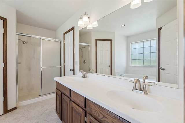 8317 NW 105th St, Oklahoma City, OK 73162 - bathroom featuring a shower stall, a bath, double vanity, and tile patterned flooring