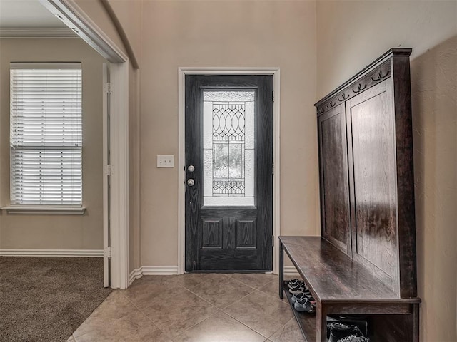 2313 NW 154th St, Edmond, OK 73013 - foyer with ornamental molding and light tile patterned floors